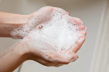 soap foam in female hands