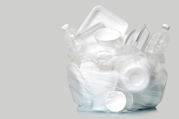 Group of Products made of plastic and foam in garbage bags