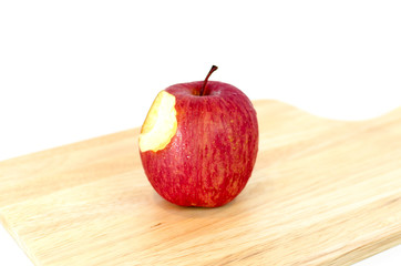 cut red apple on wood plate
