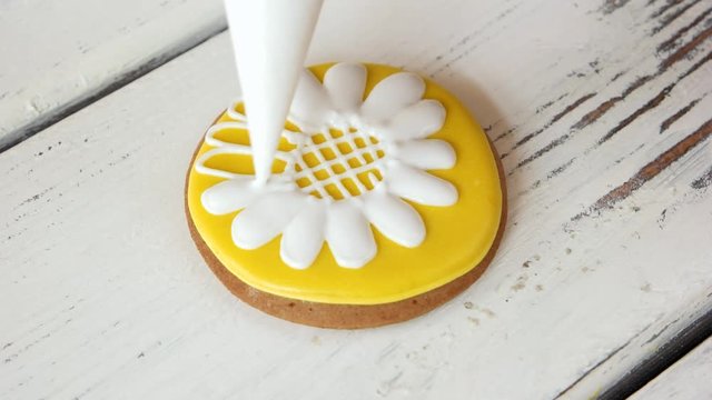 Decoration of cookies for sale. Yellow decorative biscuit with image of flower. How to decorate cookies.