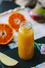 Fresh natural mango and orange fruits smoothie.