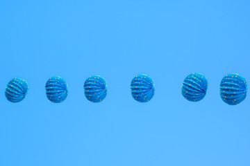 blue lampions on clear blue sky