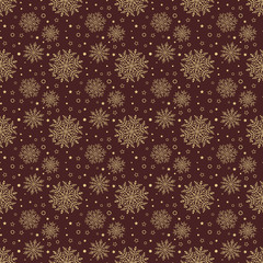 Winter background with small and big snowflakes. Seamless abstract brown and golden background. Pattern with different snowflakes