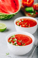 Watermelon and Tomato Gazpacho in white bowls.