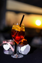 Sunset with drink, Aperol spritz at a wooden pier at sunset. 