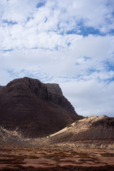 Sao Vicente Cape Verde. Surreal mars like landscape with majestic red volcano crater surrounded by sand dune in the distance