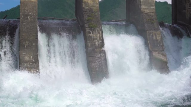 The dam of an abandoned hydroelectric power station located on a mountain river.