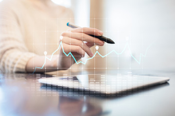 Diagrams and graphs on virtual screen. Business strategy, data analysis technology and financial...