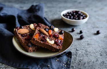 Chocolate puffed quinoa bars with freeze dried black currant, candied papaya, cashew nuts, almonds...