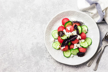 Watermelon cucumber feta salad with balsamic dressing. Top view, copy space.