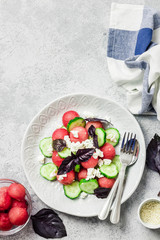 Watermelon cucumber feta salad with balsamic dressing. Top view, copy space.