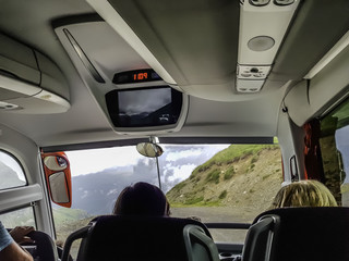 A trip by bus on mountain roads.