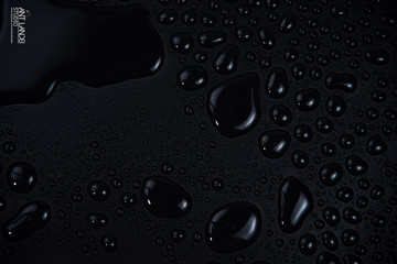 Drops of water on black background. isolated background and texture