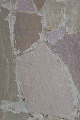 Rough multycolored unregular shape Stones floor with white cement between