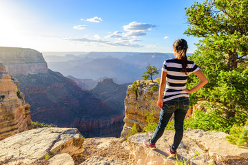 Hiker in amazing Landscape scenery of South Rim of Grand Canyon National Park, Arizona, United...
