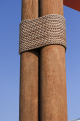 Wooden poles connected by rope