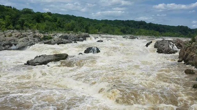 The Potomac river rapids swollen by heavy rains, at the Great Falls, in Maryland, USA
