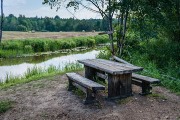 Fototapeta na wymiar Picnic place next to the river. Soomaa National Park. Estonia. Baltic. Soft focus.