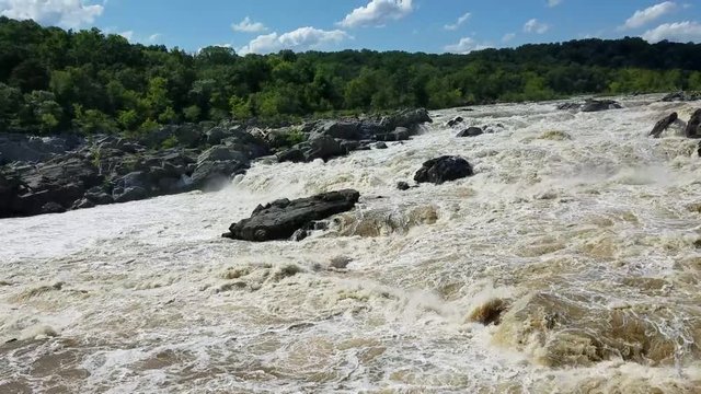 The Potomac river rapids swollen by heavy rains, at the Great Falls, in Maryland, USA
