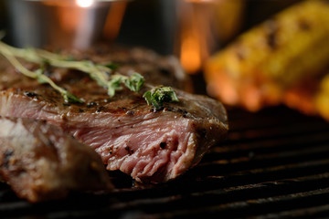 Grilled meat with vegetables and sauce, on the grill