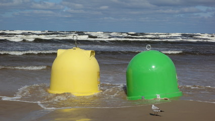 garbage cans on the beach after the storm