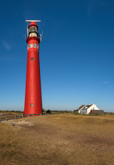 The red North Tower lighthouse on the Dutch island Schiermonnikoog, The Netherlands