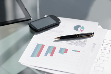 mobile phone and pen at the businessman's workplace