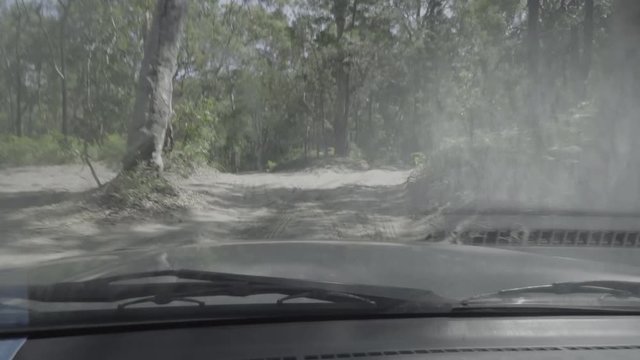 Four-wheel drive vehicle driving through a forest in Australia
