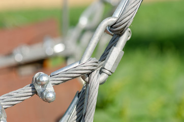 Metal rope fastening, a park of rock-climbers