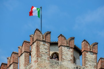 Tourists at medieval Sirmione Scaliger Castle, Italy