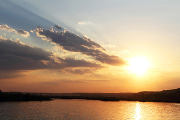 Beautiful and gentle sunset. Pastel shades. The concept of peace and tranquility. Selective focus, side view, copy space.