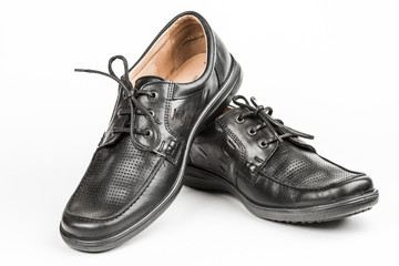 Black leather male shoes, white background