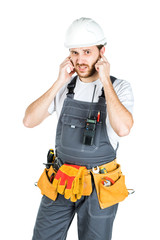 A builder or an employee in a protective helmet is listening. Isolated over white background.