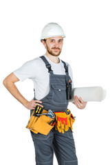 A builder or employee in a protective helmet with drawings in hand. Isolated on white background