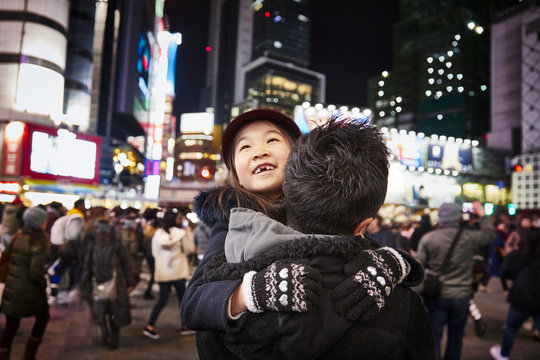 Girl with father in big city