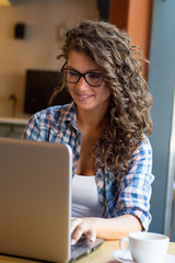 Freelancer woman working using  laptop and drink coffee  at cafe shop .