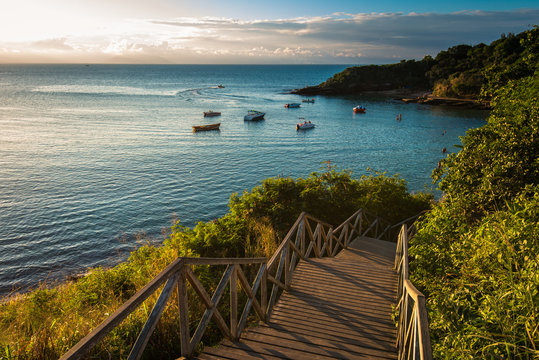 Fototapeta Wooden Stairs Leading to the Azeda Beach by Sunset in Buzios, Brazil