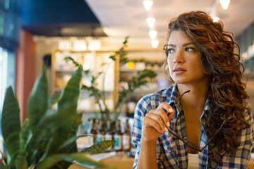 Beautiful brunette female with serious expression.Businesswoman