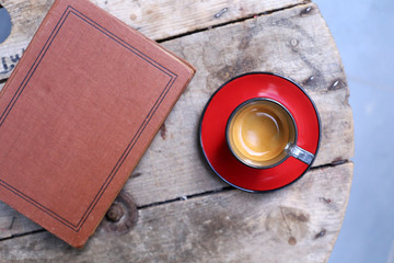 coffee espresso and book on wooden table