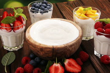 Yogurt and berry. Fresh fruit yogurt with fresh berries and peaches