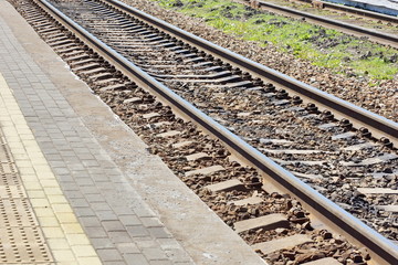 Fototapeta premium railway track at the railway station platform