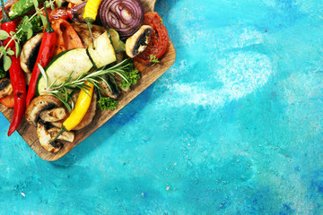 Grilled vegetables. Tomatoes, zucchini, bell pepper and fresh herbs.