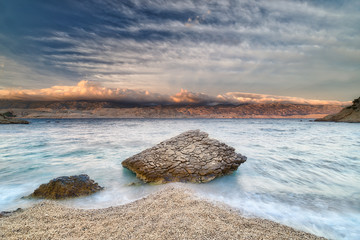 Rock on a pebbly beach, Pag, Croatia