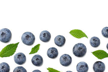 healthy background. blueberries with leaves isolated on white background. top view
