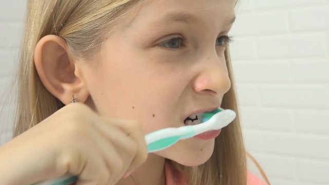 Child Brushing Baby Teeth in Bathroom, Girl Washing by Toothbrush, Kid in Mirror