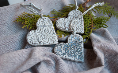 Vintage christmas handmade ornaments hearts from polymer clay.White and silver romantic hearts.