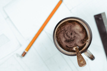 mug on the table with papers