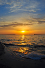 Obraz premium sunset over the sea in a bay in the city of Sevastopol