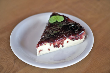 Slice of cheesecake with jam covered