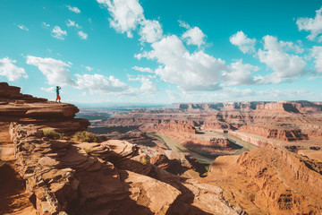 Hiker on a cliff in Dead Horse Point State Park, Utah, USA
